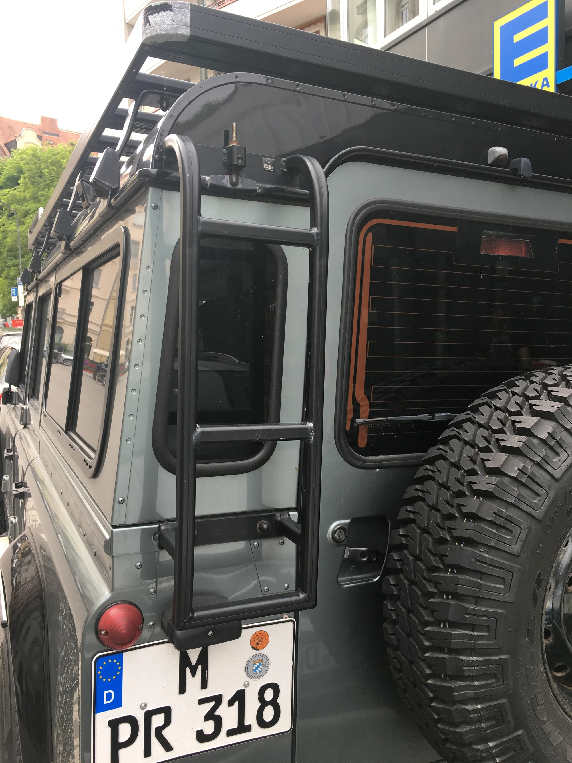 Roof rack, access ladder and spare wheel on a four-wheel-drive vehicle